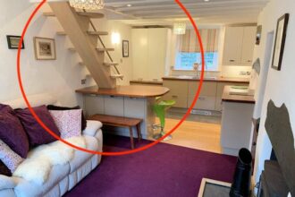 Charming cottage in Abergynolwyn, mid Wales, listed for £165,000 features a quirky layout, with a floating staircase passing through the kitchen table.