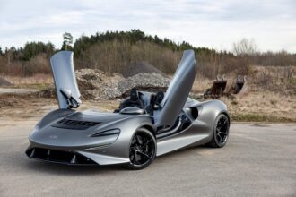 The inaugural McLaren Elva, with chassis number one and under five miles on the odometer, is set to fetch £939,000 at auction. This supercar, boasting a twin-turbocharged 804 bhp engine, originally priced at £1.42 million in 2022. Despite being adorned with £77,000 worth of enhancements, it's being offered at a substantial discount. The auction, hosted by RM Sotheby’s in Monaco on May 11, presents an opportunity to acquire one of McLaren's most groundbreaking creations at a fraction of its original cost.
