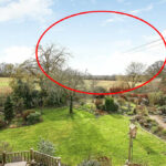 A spacious five-bedroom house with breathtaking views, listed at £865,000 in Whiteparish, near Salisbury, captures attention as power cables mysteriously vanish in garden photos.