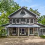 Johnny Cash's custom-built home for his son hits the market for $6.25 million. Rustic charm and serene woodland setting await in Hendersonville, Tennessee.