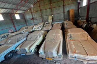 A hidden treasure trove of classic cars, including vintage Porsches and Mercedes, discovered in an abandoned warehouse, astounds car enthusiasts. The late owner's remarkable collection heads to auction.