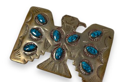 John Lennon's iconic eagle-shaped belt buckle, worn throughout the 1970s, is expected to fetch £35,000 at auction. Accompanied by a handwritten note from Lennon himself to Spence Berland, the VP of 'Record World Magazine', the buckle holds historical significance. Other items in the auction include windows from George Harrison's 1964 E-Type Jaguar and personal tapes from Ringo Starr, offering unique insights into Beatles history.