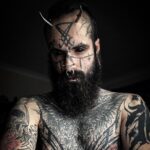 An ink enthusiast, Mattia, has spent over £25,000 on tattoos and body modifications, including eyeball tattoos and metal horns, despite facing criticism from family and friends. He embraces his unique appearance, stating that others' opinions are irrelevant. Despite challenges, he plans to continue modifying his body, emphasizing the importance of thorough research and personal desire in body modification.