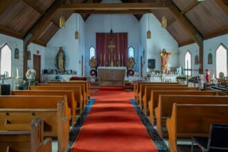 Urban explorer discovers abandoned chapel with cremated remains left behind. Footage reveals untouched interior, including display of ashes and set-up for service.