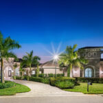 A $4.5 million mansion in Fort Myers, Florida, offers luxury living with a fortified safe room, 12-car garage, and a $1 million home cinema. Boasting 32 security cameras and lavish amenities, it's an unparalleled sanctuary for sophisticated living. Listed with the Aaron Wolf Group at John R Wood Christie’s International.