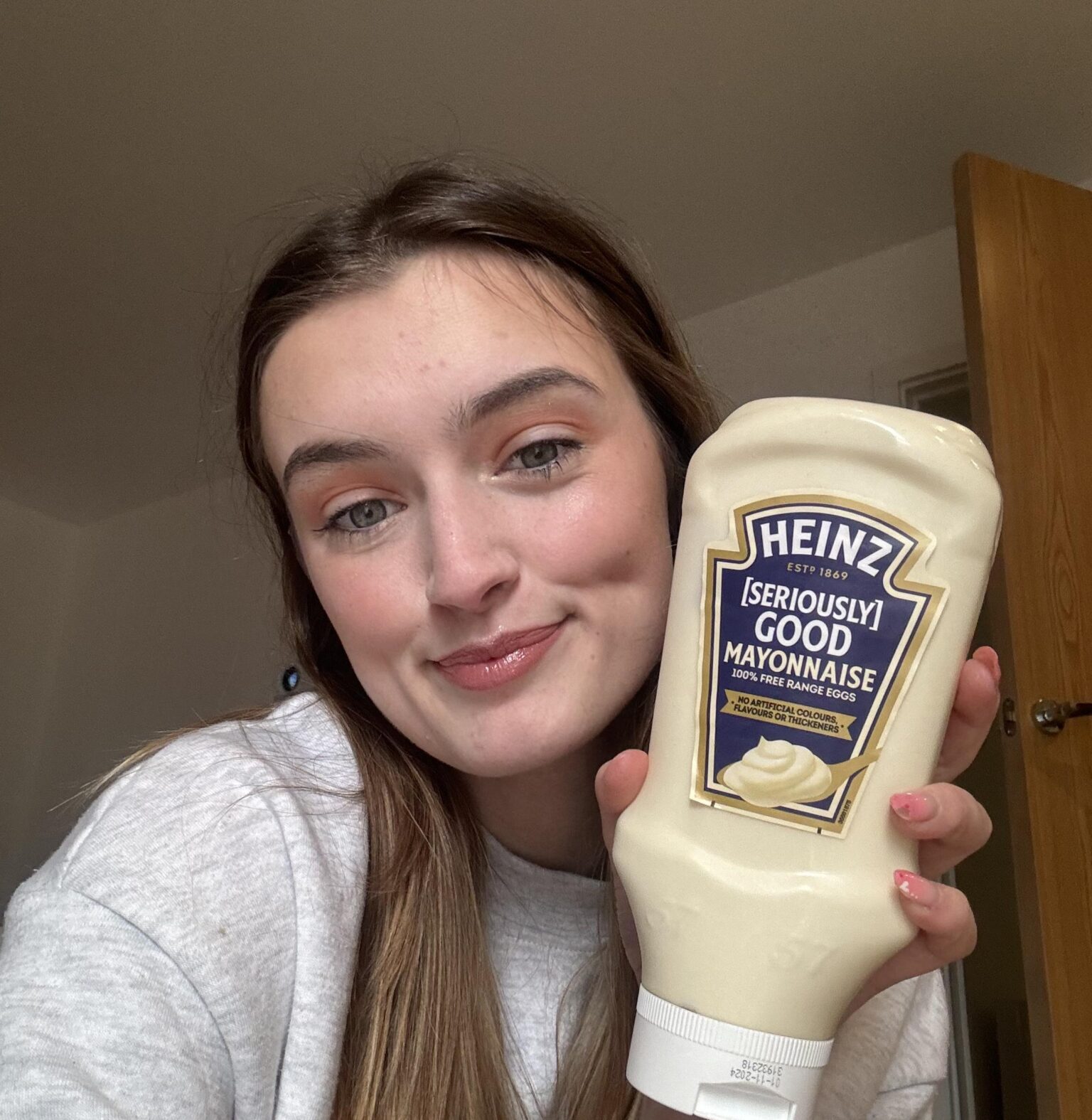 Megan Tompkins' unusual love affair with mayonnaise as she consumes 156 bottles annually, integrating it into every meal.