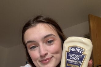 Megan Tompkins' unusual love affair with mayonnaise as she consumes 156 bottles annually, integrating it into every meal.