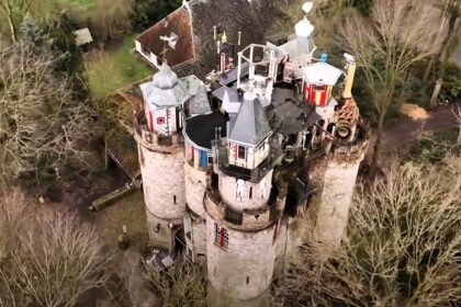 A pensioner's 85ft castle in his garden, built over 34 years in the village of Blesdijke, Netherlands, boasts four towers and medieval flair.