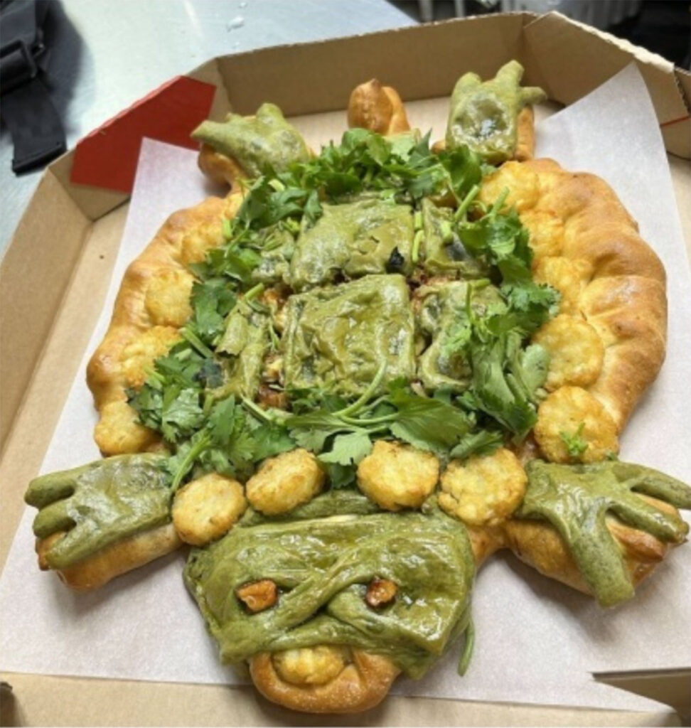 Experience shock as Pizza Hut unveils a turtle-shaped pizza with green sauce, inspired by Teenage Mutant Ninja Turtles. Mixed reactions ensue.