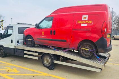 A Royal Mail van broke down and was put on a recovery truck, but both were overweight due to parcels. Police issued a prohibition notice.