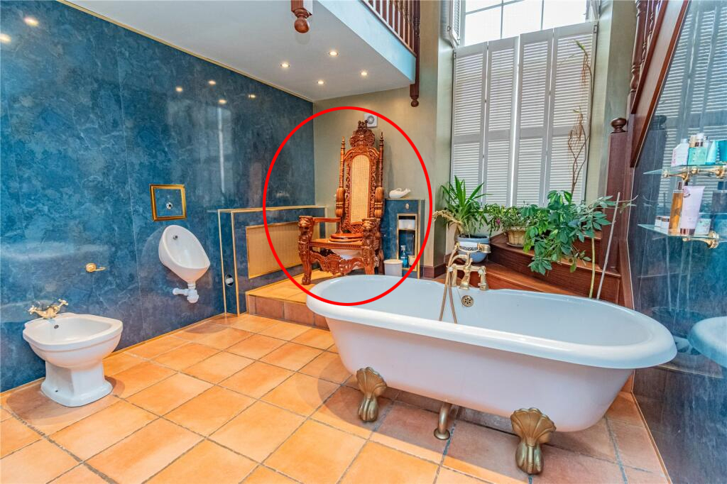 A £575,000 Grade II Listed house boasts a unique bathroom with a literal throne for the toilet, jacuzzi, and sauna. Set in beautiful gardens, it's a 400-year-old gem.