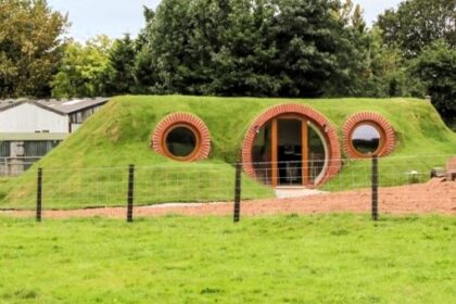Experience the magic of Hobbiton with a stay at Shire’s End, a charming underground pod nestled in the fields of Little Hereford, offering picturesque views and a cozy retreat for Lord of the Rings fans.