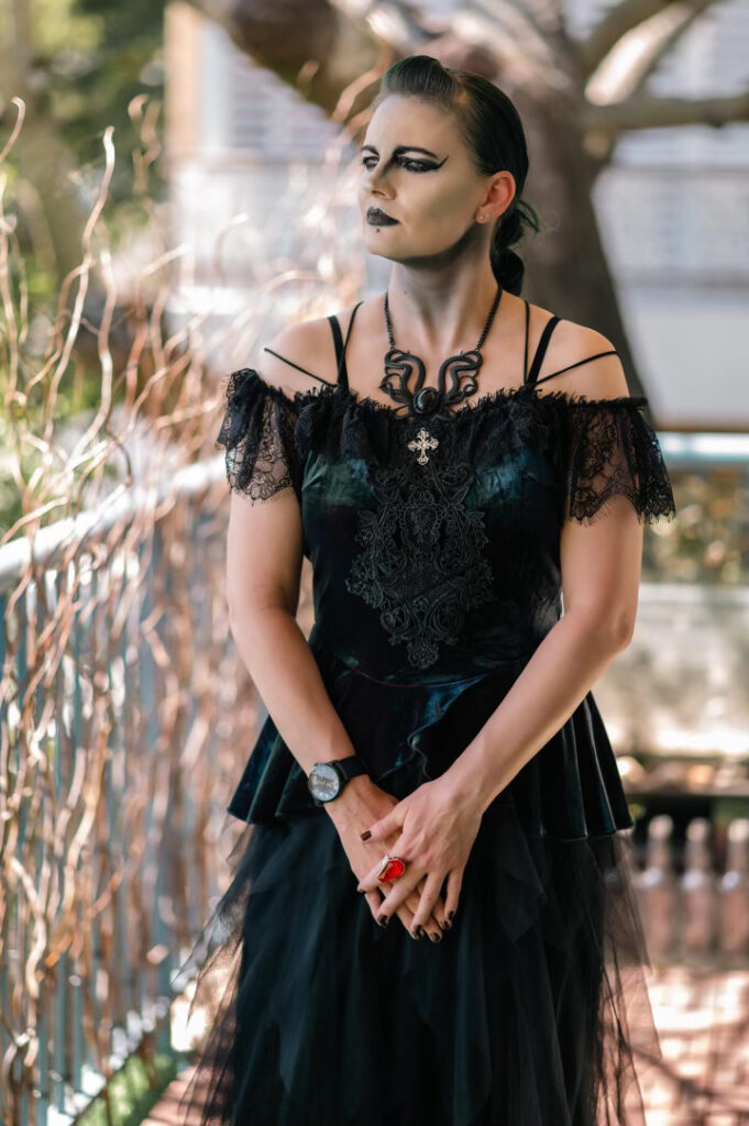 Kalila Matthews shares her gothic mum's unique decor, including coffins, facing judgments but embracing their unconventional style unapologetically.