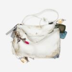 Balenciaga faces criticism for offering a £8,500 handbag with fake stains and marks, sparking debate over its unique, yet controversial, design choices.