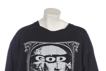 Kate Moss's £600 T-shirt, worn on an i-D magazine cover in 2004, features a print of George Washington with 'God Save America' slogan, set for auction.