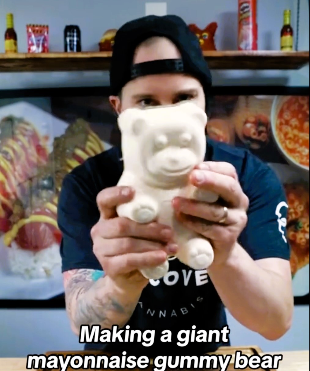 The Vulgar Chef, known for his unconventional food creations, stirred controversy with a mayonnaise gummy bear. Mixing mayo with gelatin, he crafted the treat, evoking strong reactions from viewers.