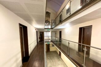 The conversion of a church into flats in Bolton has sparked criticism, with its narrow corridors and small living spaces likened to a prison. Despite maintaining original features, the apartments are receiving mixed reactions from locals.