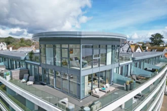 A luxurious duplex penthouse in Falmouth, Cornwall, boasting stunning views and modern features, is on sale for £1.8m, having hosted celebrity guests like Robbie Williams.