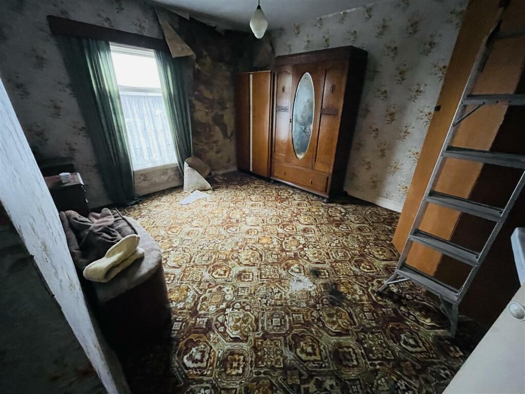A fixer-upper cottage in Nuneaton is generating buzz with its eerie interior and a cramped bathroom featuring an oddly placed tub. Despite the need for renovation, its prime location and potential for expansion make it an attractive prospect for buyers. Listed at £90,000, it's set to go to auction with Pointons Estate Agents.