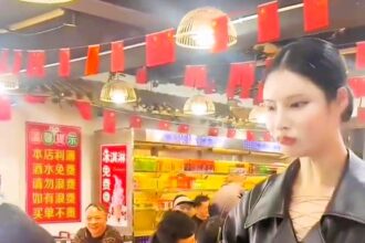 Diners at a Chongqing restaurant were stunned by what appeared to be a robot waitress serving meals, only to discover it was actually the manager, Qin, showcasing her impressive dance skills to entertain customers.