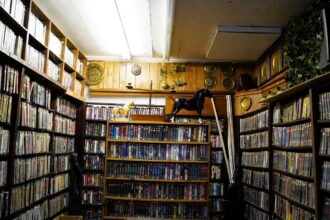 Urban explorer discovers a frozen moment in time at an abandoned VHS store, uncovering shelves stocked with relics from a bygone era, sparking nostalgia and fascination among viewers.