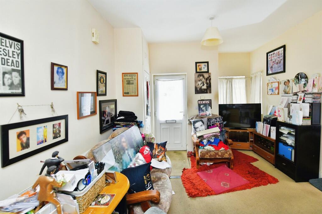 A one-bed house in Plymouth hits the market for £80,000, but it's filled with Elvis Presley memorabilia, prompting online reactions ranging from amusement to skepticism.