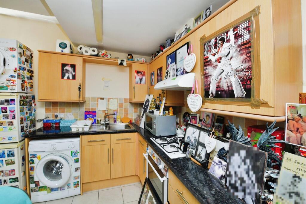 A one-bed house in Plymouth hits the market for £80,000, but it's filled with Elvis Presley memorabilia, prompting online reactions ranging from amusement to skepticism.