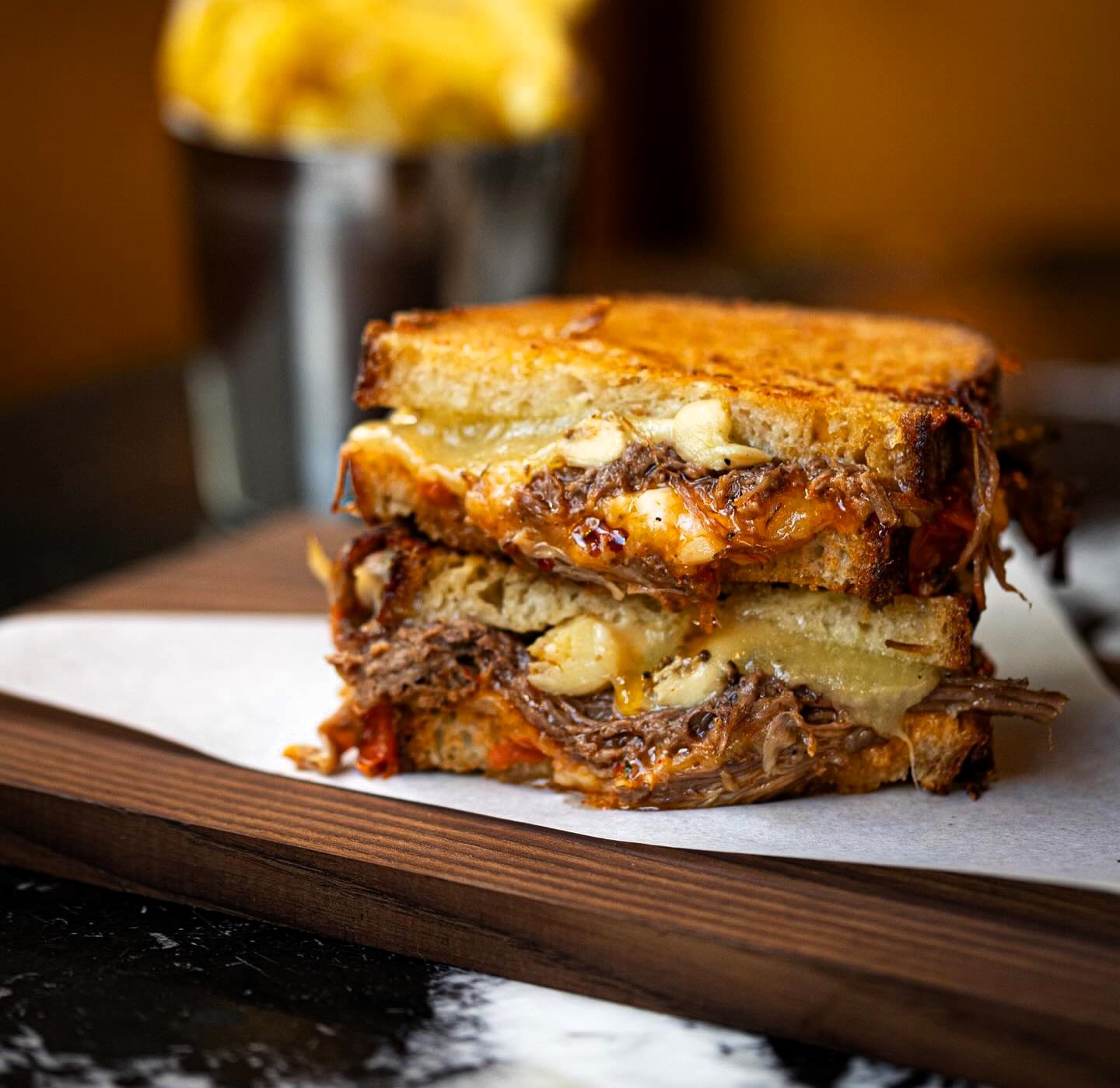 Gordon Ramsay offers an 'idiot sandwich' for £24, complete with braised short rib, cheddar, confit mushrooms, and spiced tomato chutney on sourdough. Mixed reactions ensue.