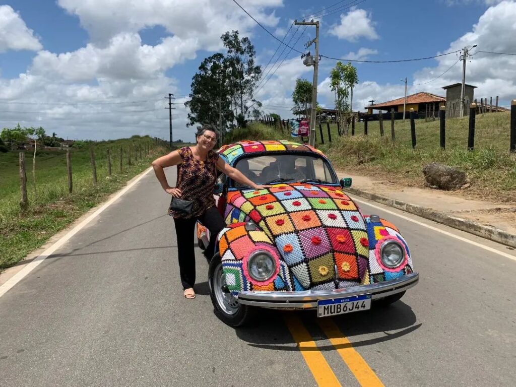 Ana Lúcia Vergetti, a color-loving grandmother from Brazil, spent six months adorning her entire VW Beetle with eye-catching crochet as a unique advertisement for her haberdashery business. Her intricate design, including flowers and an owl, has captured the attention of locals and passersby alike.