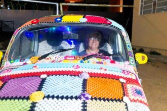 Ana Lúcia Vergetti, a color-loving grandmother from Brazil, spent six months adorning her entire VW Beetle with eye-catching crochet as a unique advertisement for her haberdashery business. Her intricate design, including flowers and an owl, has captured the attention of locals and passersby alike.