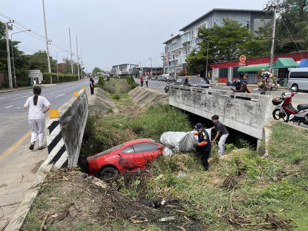 A mechanic crashes a £450,000 Ferrari into a ditch while testing it after repairs in Bangkok. The supercar, a Ferrari F430, sustains significant damage, while the mechanic escapes with minor injuries. Investigation underway.