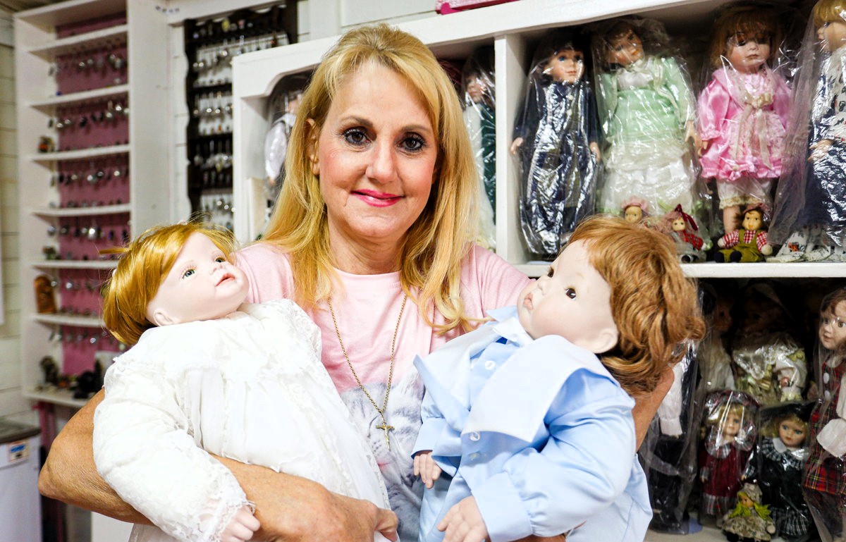 Lynn Emdin's collection of 1,000 porcelain dolls began as a tribute to a lost friend, now offering solace and a safe haven in her 'She Shed'.