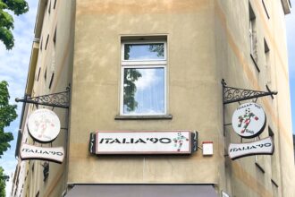 A pub in Cologne, Germany, named Italia 90, pays homage to the iconic 1990 World Cup, drawing football fans who reminisce about memorable moments like England's heartbreak and Cameroon's Roger Milla's celebratory dance.
