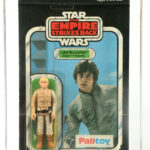 Vintage Luke Skywalker and Han Solo toys, sealed in original packaging, are up for auction, each expected to fetch £12,000. Also included are a Yak Face figure and a Jawa toy with a vinyl cape, among other Star Wars memorabilia.