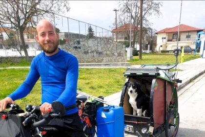 Man reunited with his dog Raika after a year of separation during a cycling trip across Europe, thanks to a Serbian animal shelter's microchip discovery.