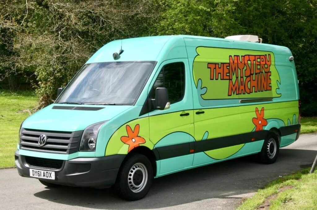 Get ready to solve mysteries in style with your very own 'Mystery Machine' camper van, complete with vibrant exterior, leopard print seats, and funky curtains. Ideal for adventures and hosting, this iconic van could be yours for just £1,300.