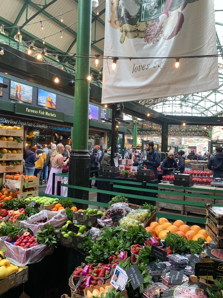 At a London food market, a rare black truffle fetches a hefty price of £310 per 100 grams, leaving shoppers astonished at its luxury.