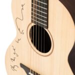 Signed Ed Sheeran guitar from 'Subtract' tour up for grabs at £320 in charity auction. Iconic Love Actually script, The Crown memorabilia, and Hollywood donations add star power to War Child fundraiser.