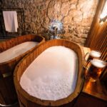 Experience the bizarre Beernarium Piwne Spa in Krakow's historic Kmitów Palace, offering beer, wine, and milk baths with purported benefits like skin moisturizing and hair improvement.