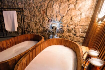 Experience the bizarre Beernarium Piwne Spa in Krakow's historic Kmitów Palace, offering beer, wine, and milk baths with purported benefits like skin moisturizing and hair improvement.