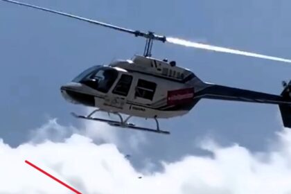 Fitness influencer drops £1,500 from helicopter over beachgoers in Brazil, leaving crowd cheering. Video goes viral, sparking admiration and excitement.