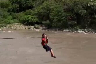 Schoolchildren in northern Colombia brave an alligator-infested river daily, using a terrifying zipline to reach class. Despite promises for a new bridge, they rely on this perilous system.
