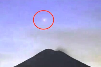 A mysterious glowing light descends into a smoking crater at Mexico's Popocatepetl volcano, captured on camera. Could it be an inter-dimensional portal?