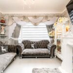 A north London terraced house with a unique grey velvet interior has been dubbed 'migraine-chic' by online critics, drawing attention for its dizzying wallpaper and bold color choices.