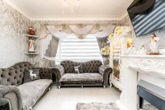 A north London terraced house with a unique grey velvet interior has been dubbed 'migraine-chic' by online critics, drawing attention for its dizzying wallpaper and bold color choices.