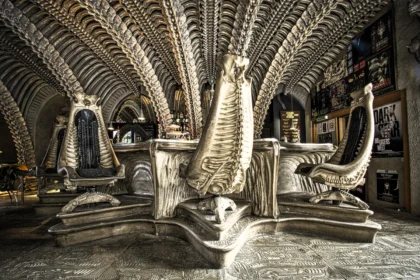 Booze-loving Brits can immerse themselves in the eerie world of the Alien franchise at a bar in St Germain, Switzerland, designed by the late artist Hans Ruedi Giger, featuring skeletal furniture and a bio-mechanical atmosphere reminiscent of the films.