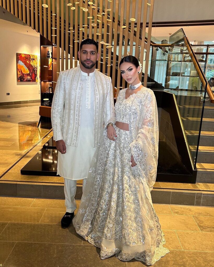 Amir Khan’s £11.5 million wedding venue in Bolton, resembling a Dubai-style tower, has hosted its first wedding despite earlier setbacks. The luxurious Balmayna features marble floors, chandeliers, and was criticized for its location and surrounding fly-tipped rubbish.