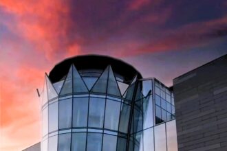 Amir Khan’s £11.5 million wedding venue in Bolton, resembling a Dubai-style tower, has hosted its first wedding despite earlier setbacks. The luxurious Balmayna features marble floors, chandeliers, and was criticized for its location and surrounding fly-tipped rubbish.