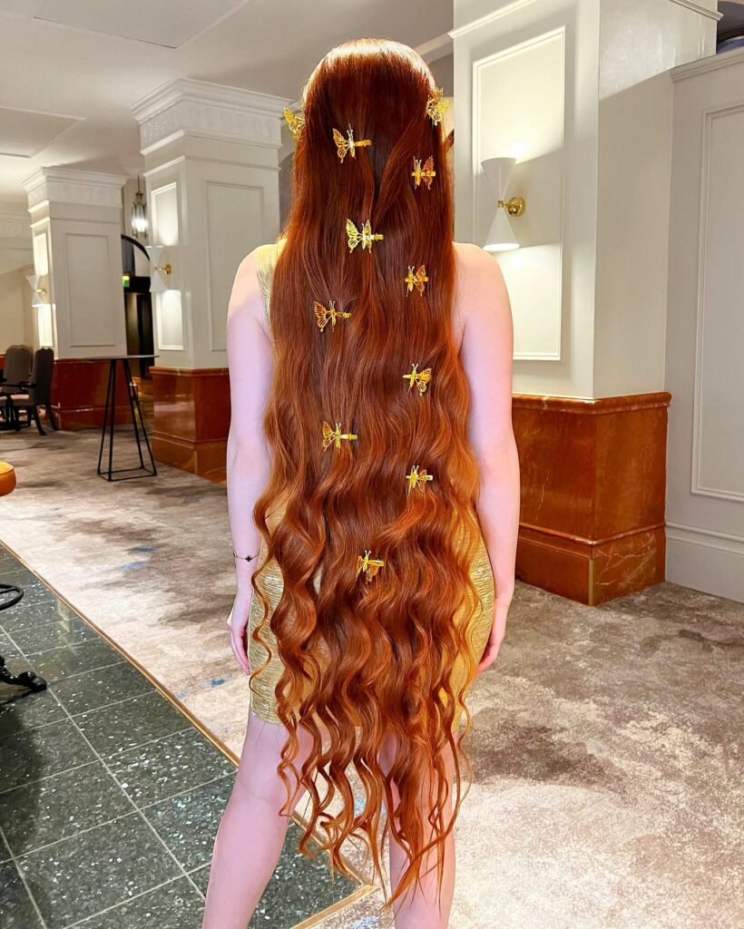 A UK woman dubbed 'real life Rapunzel' shares her secret to 4ft 7in hair growth: homemade rosemary oil and water treatments. Learn her routine for long, luscious locks.