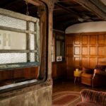 A converted 1880s train carriage in Dungeness, Kent, is for sale at £875,000. This unique home features three bedrooms, chic decor, and picturesque views, but mortgages may be difficult to secure.